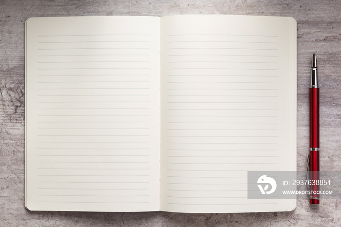 notepad or notebook paper at stone background