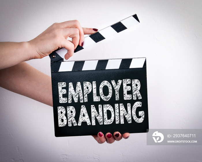 Employer Branding. Female hands holding movie clapper.