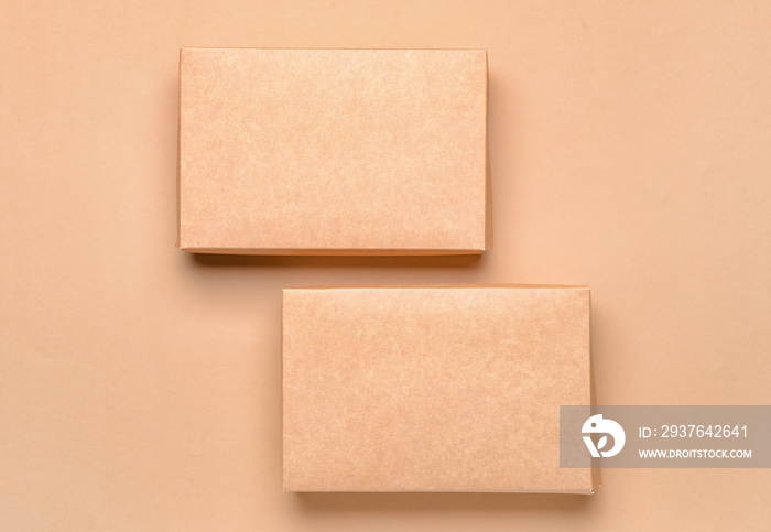 Blank cardboard boxes on color background