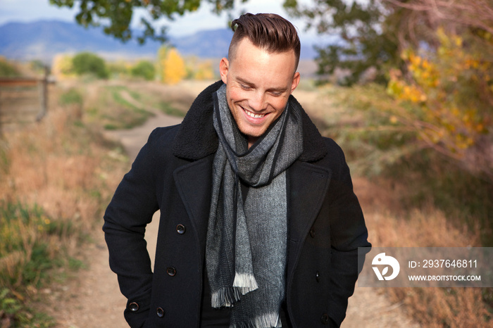 Smiling young man wearing scarf