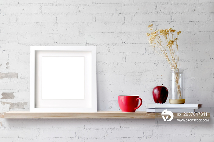 Wood shelf with blank white frame and coffee. Blank screen for products or graphic montage.