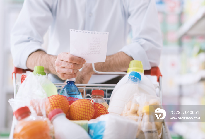 Man shopping with a grocery list