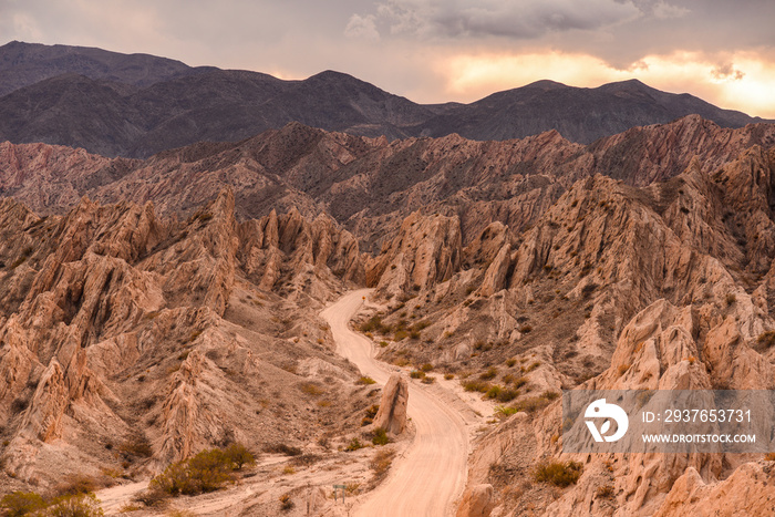 The famous Ruta 40 road at sunset winding through the geological wonders of the Quebrada de Las Flec