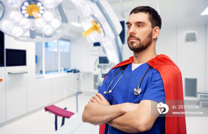healthcare, surgery and medicine concept - doctor or male nurse in blue uniform and red superhero ca