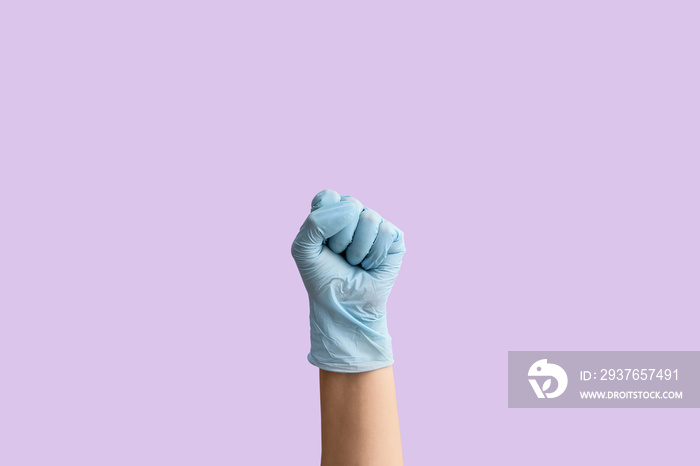 Gesturing hand in protective glove on color background