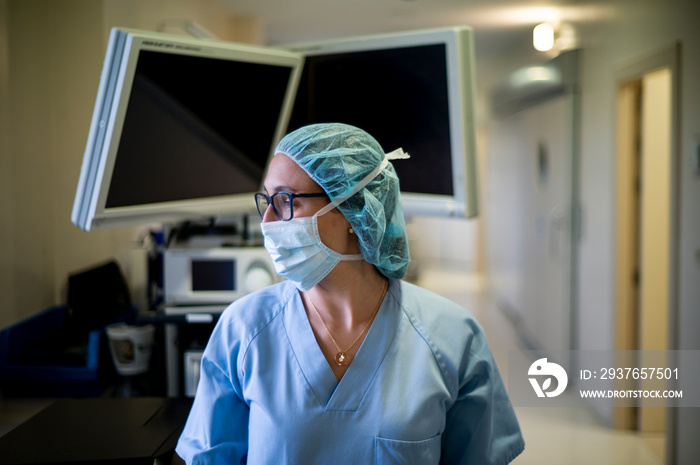 A female doctor with a mask before operation.