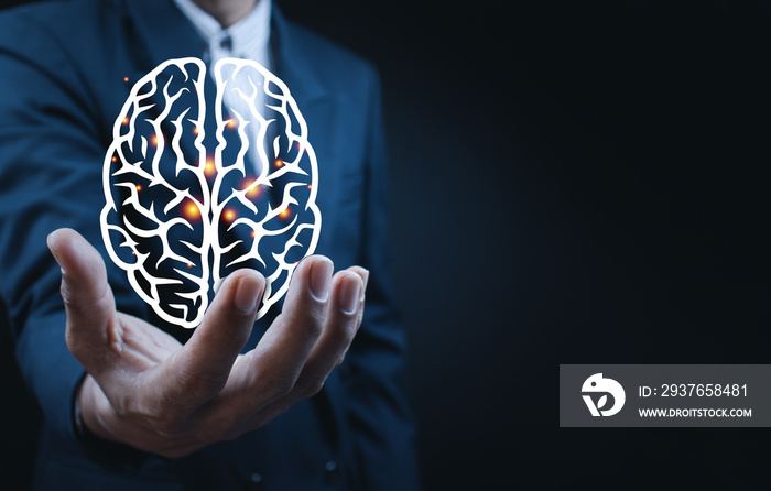 Businessman holding digital image of brain .