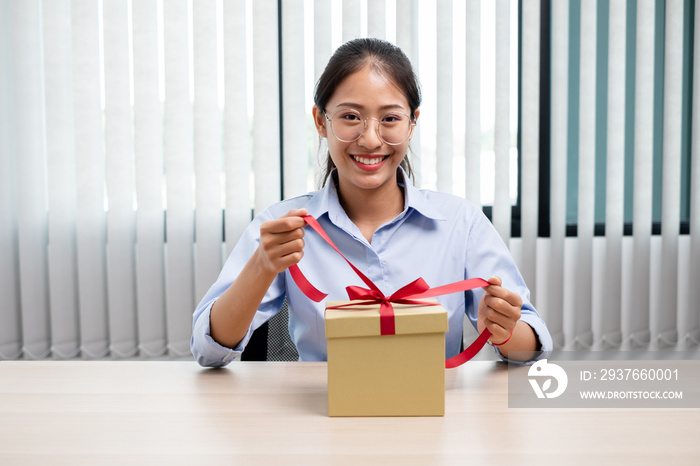 Asian women happy to open surprise box are stunned with excitement, joy and smile on holidays, Chris