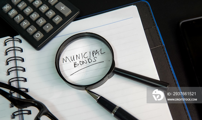 Municipal bond written on a book and documents.