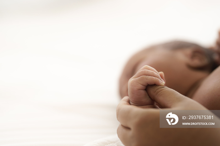 african american infant baby lying on bed