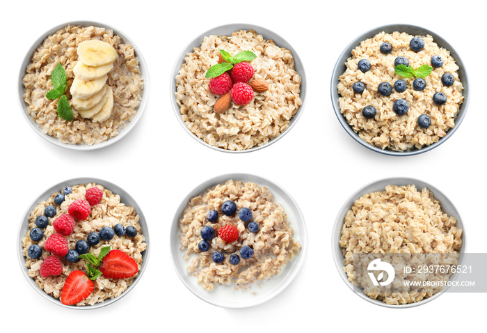 Bowls of oatmeal with berries and fruits on white background