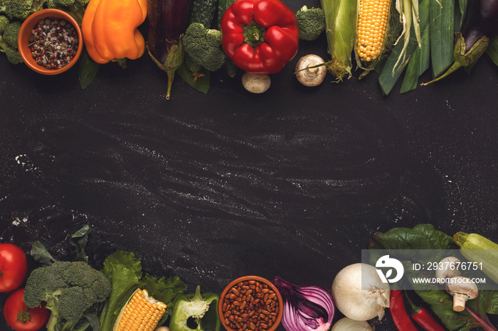 Border of fresh vegetables on wooden background with copy space