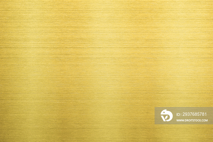 Shiny gold polished metal background texture of brushed stainless steel plate with the reflection of