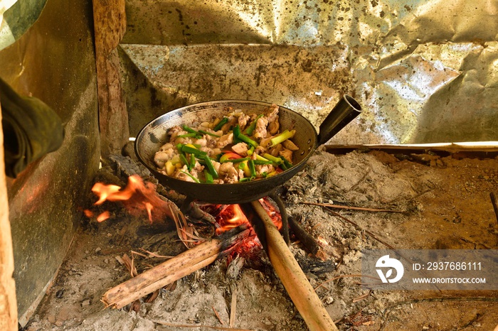 filipino style cooking with pen on wooden fire