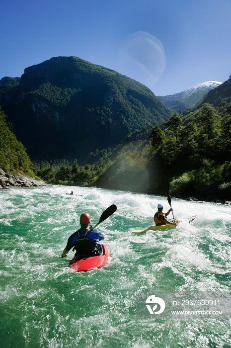 People kayaking down river