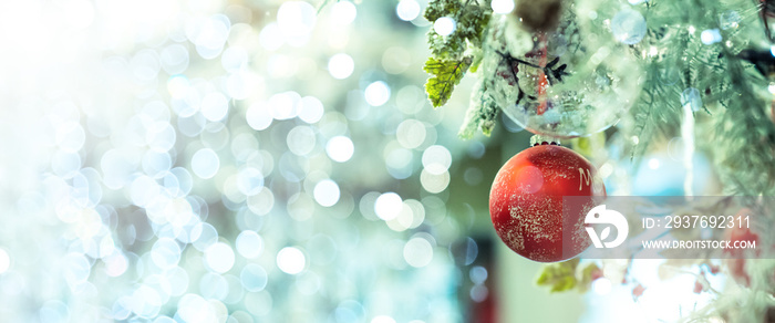 Beautiful red and gold Christmas Bauble hanging on decorated Christmas tree festive christmas eve ba