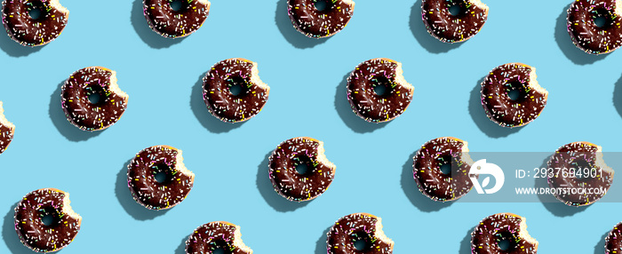 Chocolate glazed donuts overhead view flat lay