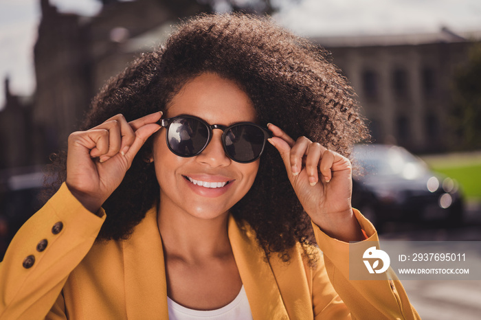 Portrait of attractive cheerful girl spending vacation weekend free time on fresh air touching specs