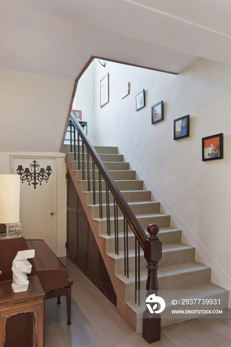 Picture frames mounted on wall along stairways at home