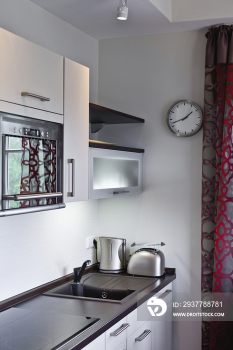 Toaster and microwave in contemporary kitchen