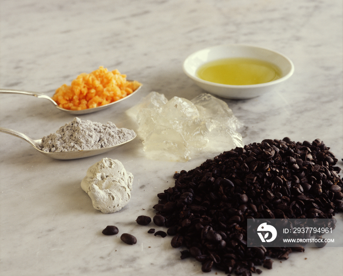 Ingredients of scrubs used in indonesia, including coffe beans, clay carrots and gelatine