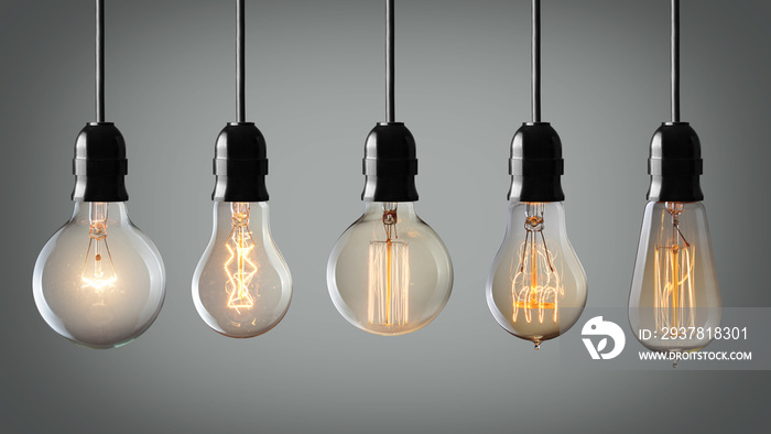 Vintage hanging light bulbs over gray background