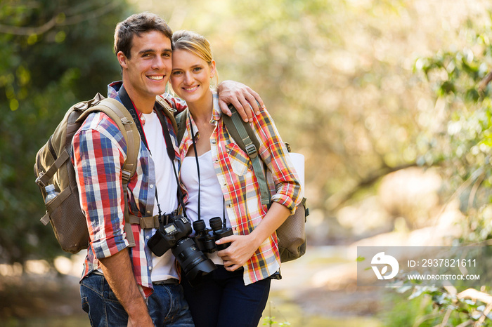 young couple hiking in mountain