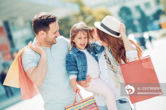 Young family enjoying shopping