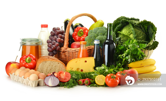 Groceries in wicker basket including vegetables and fruits