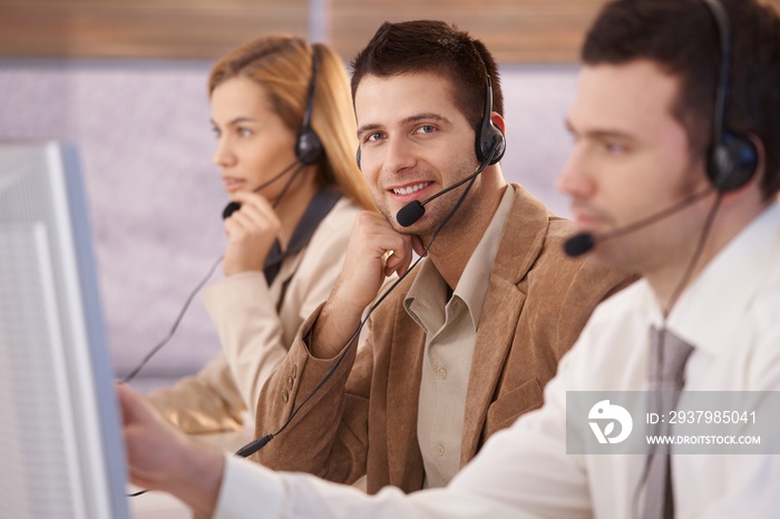 Cheerful young male dispatcher working