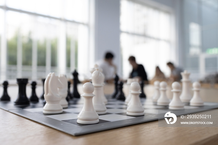 New chess board with chess pieces on table for game